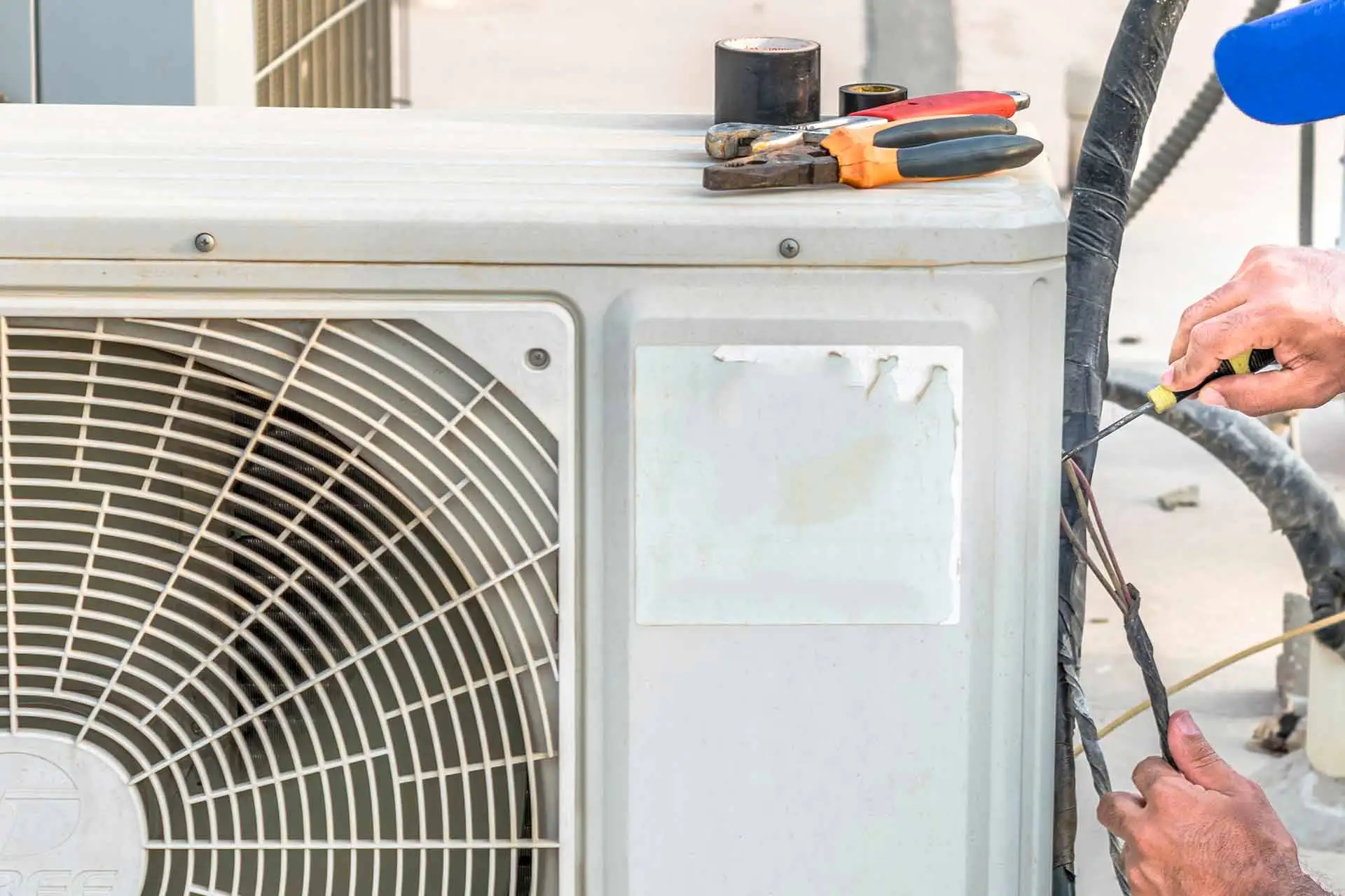 AC repairs being performed on an air conditioning unit near Winter Haven, FL.