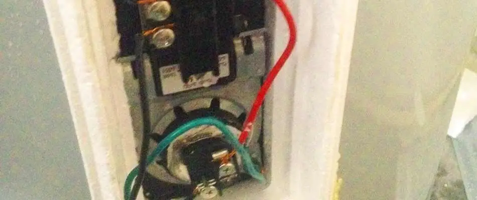 The rear panel of an electric water heater that's located in the home of a customer in Winter Haven.