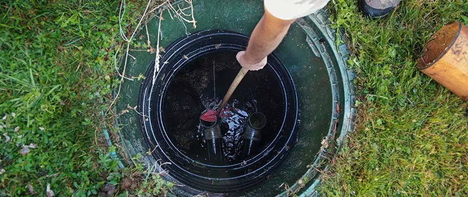 Maintenance being performed on a home septic tank system.