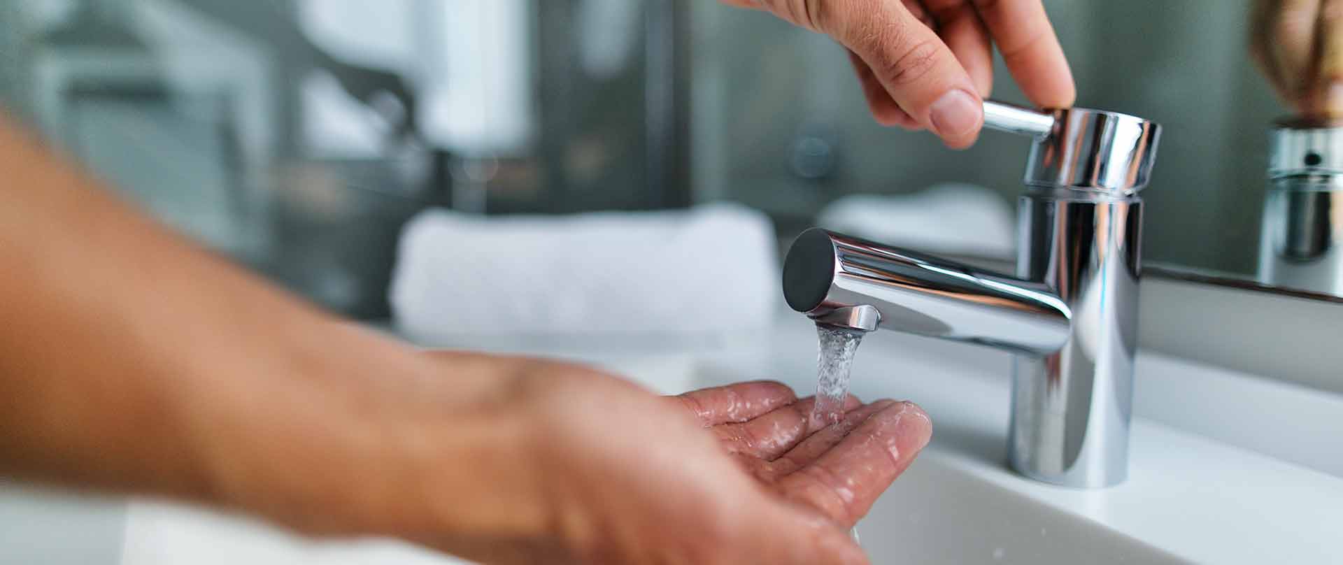 A faucet running on hands in Lakeland, FL.