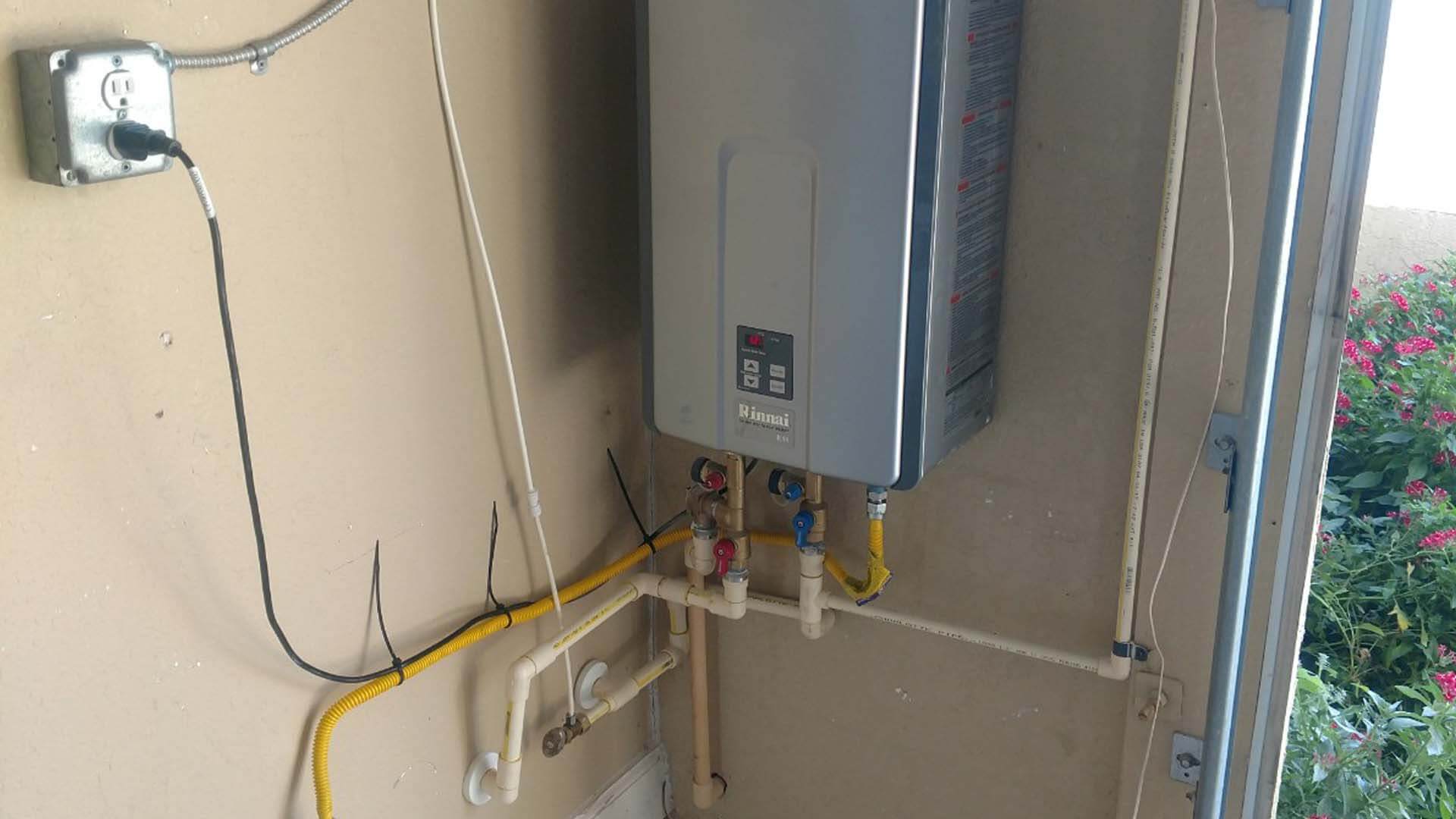 Servicing a broken water heater in a Lakeland, FL home.