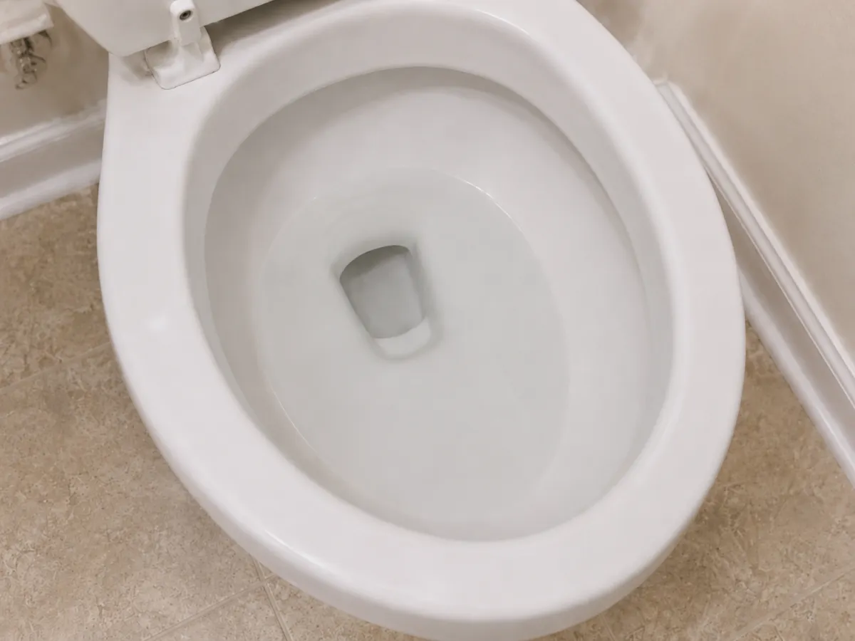 Toilet bowl at a normal water level after a clog has cleared