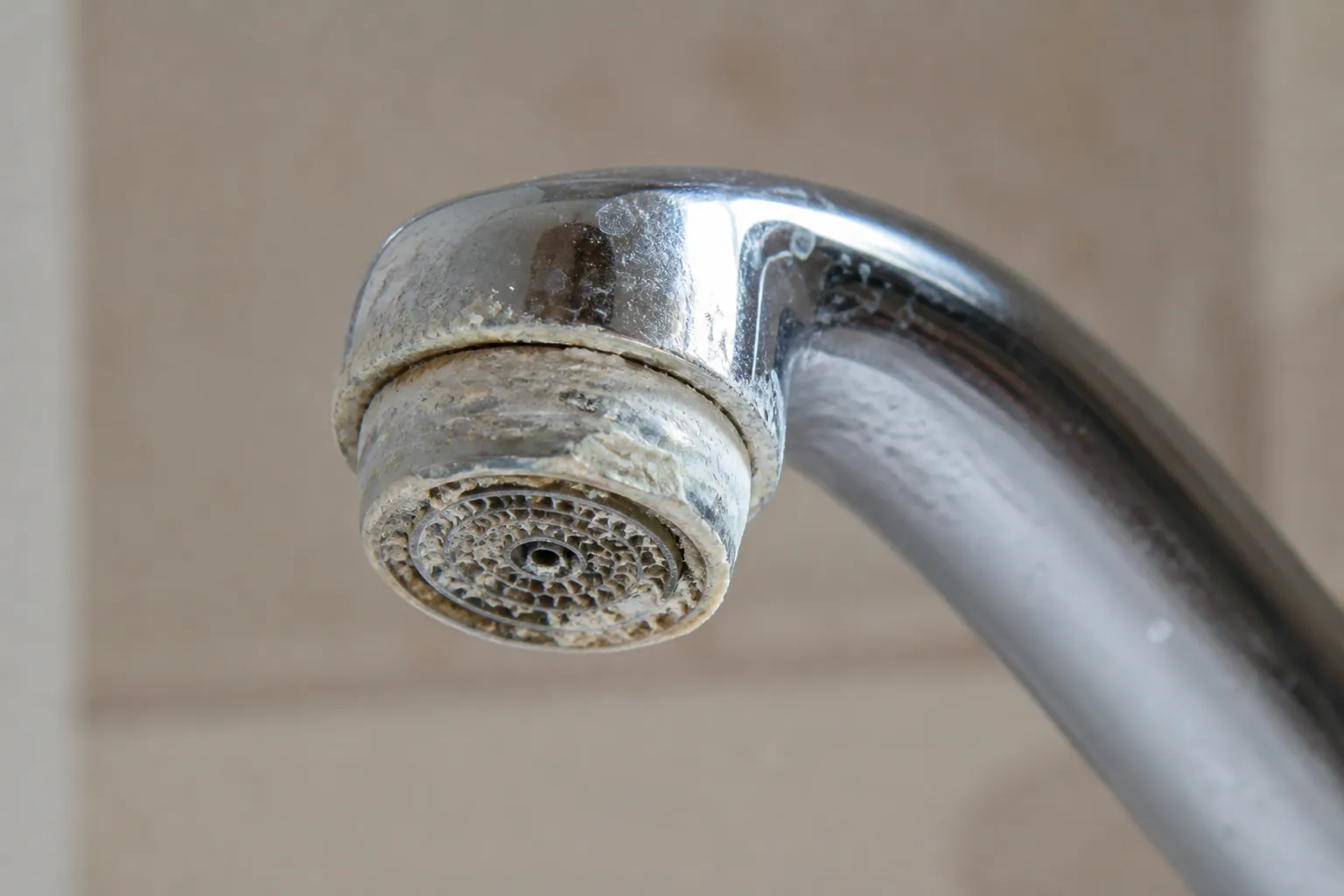 Hard water scale on a Lakeland faucet aerator in Polk County
